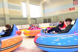 Group of young people in ice bumper cars